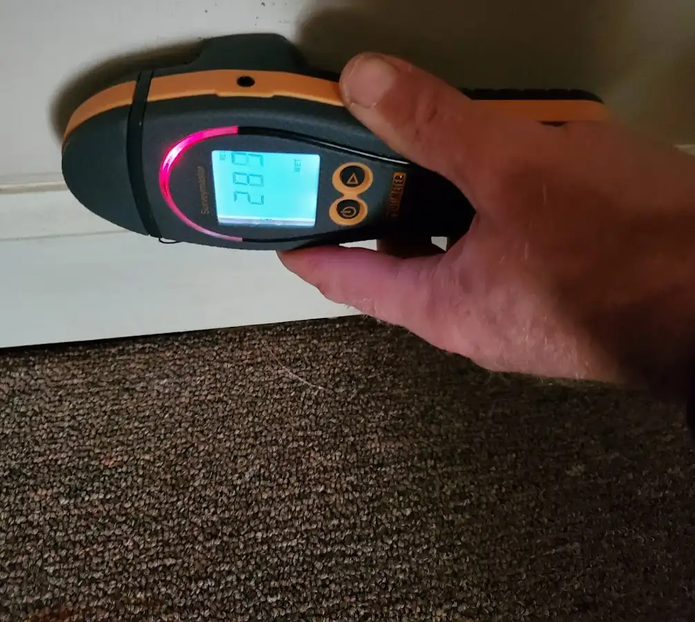 Moisture detection at baseboard during Storm Damage Restoration in Union